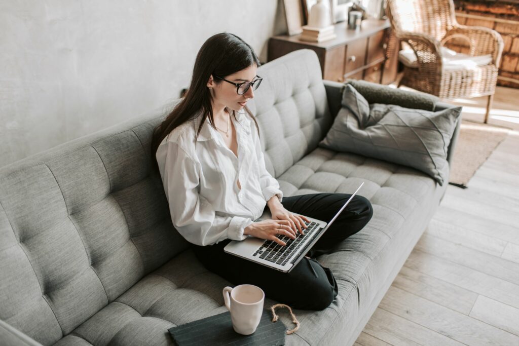 Woman working at home using a laptop.